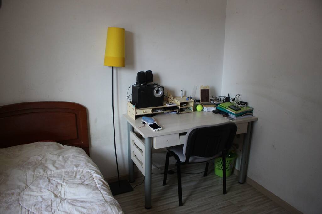 Desk and audio speakers in the bedroom