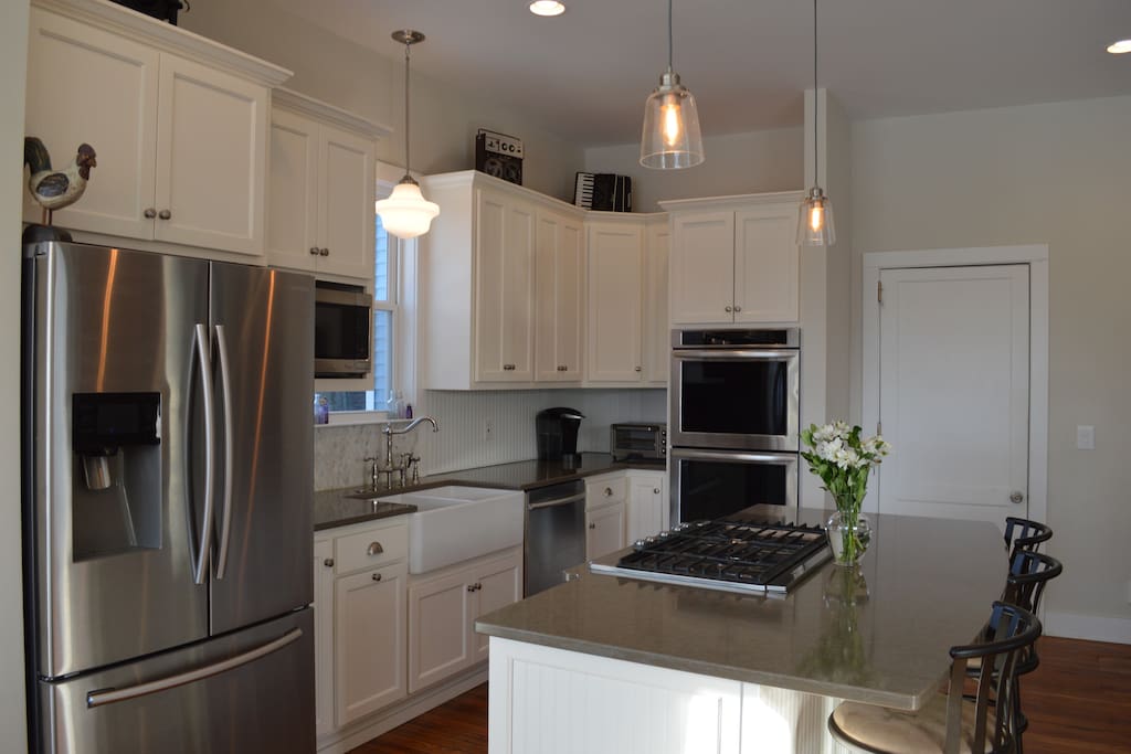 Brand new renovated kitchen with stainless steel appliances and eat in bar/kitchen