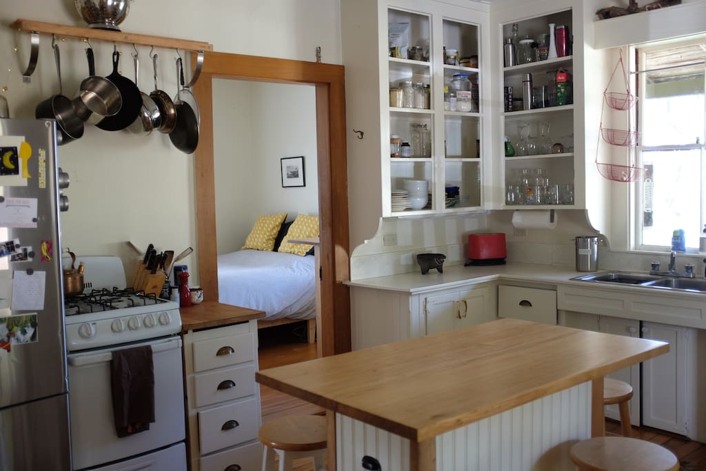 Eat-in kitchen with island + bar stools