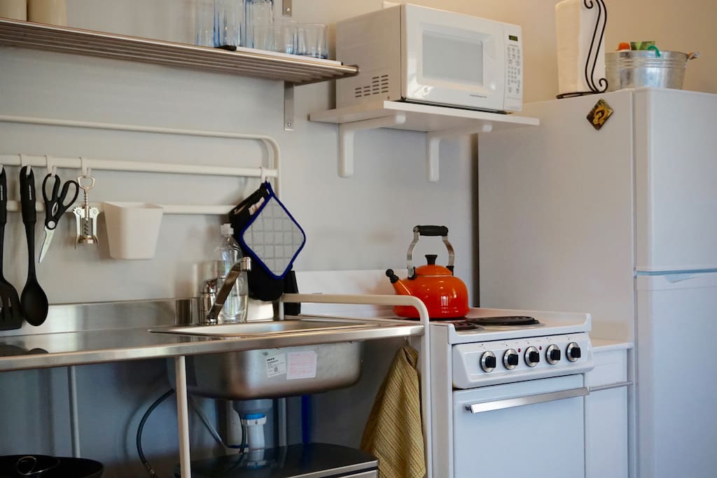 IKEA inspired kitchen for cooking or reheating simple meals. Coffee maker/tea kettle, microwave, toaster and some dishes provided.