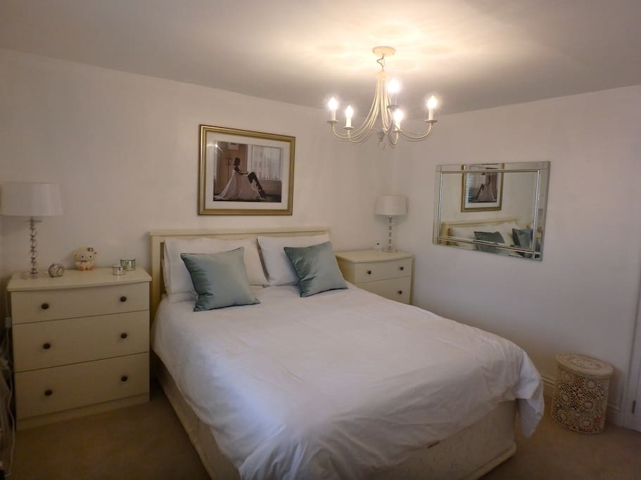 Master bedroom with wall mounted TV, high quality King size bed and luxury bed lining plus lots of wardrobe space