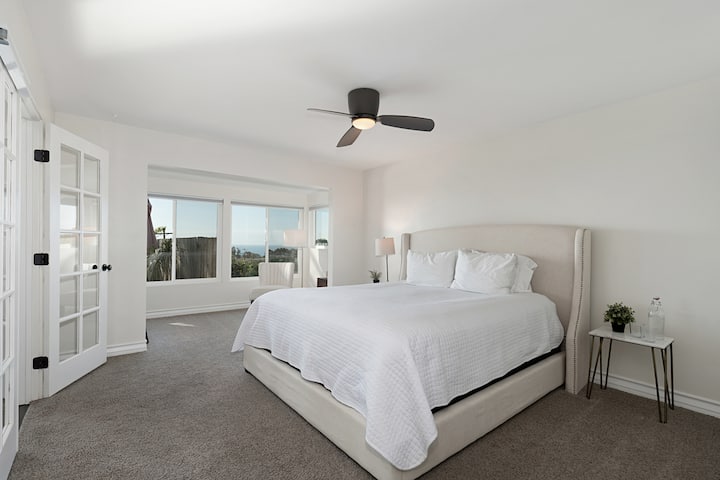 The second bedroom is complete with beautiful ocean views and ensuite shared bathroom