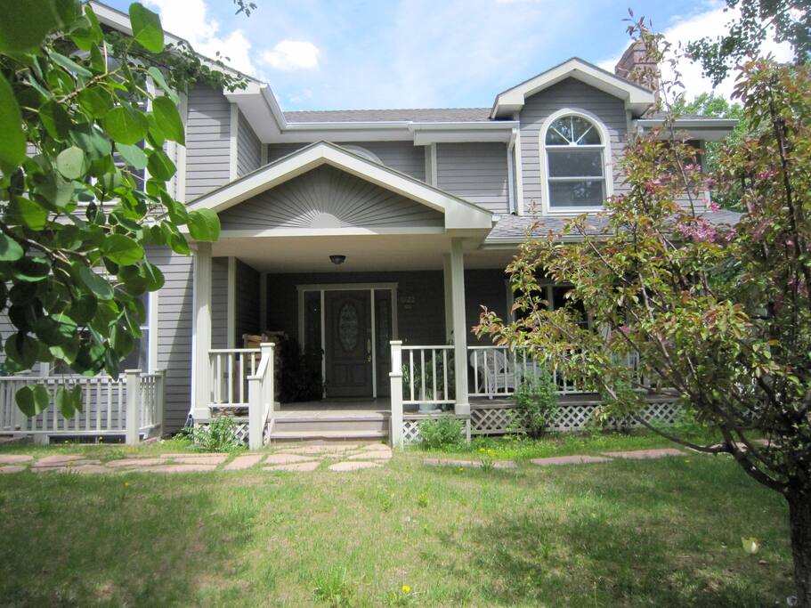 The front of our home to welcome you. Summer is GREAT!!!