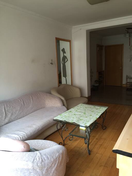 A big sitting room and dinning room, full of sunshine.