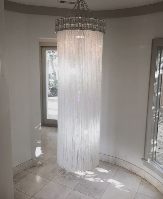 Lavish entry with beautiful chandelier.