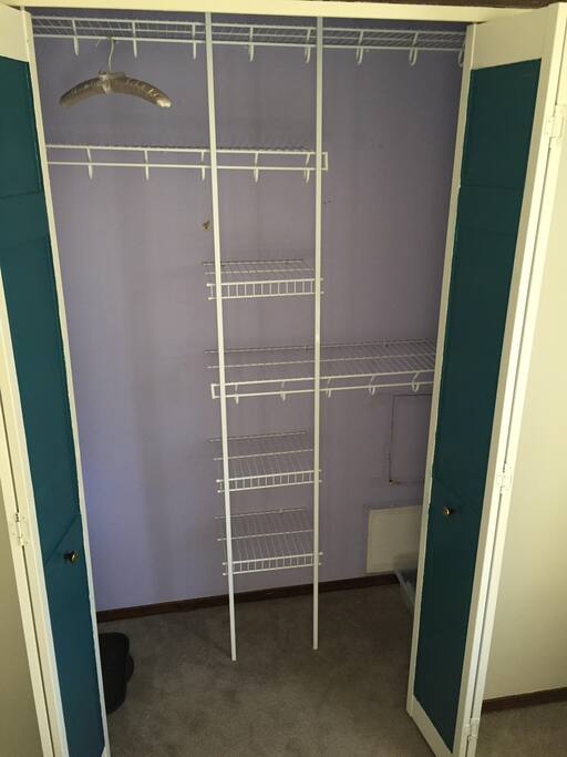 large, empty closet to organize and hang your belongings- includes a iron, ironing board