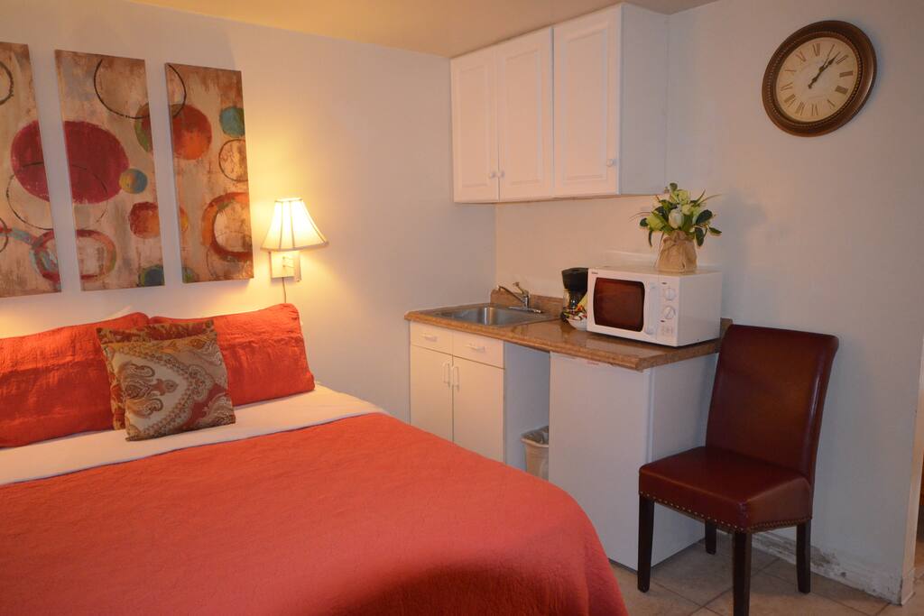 Small Kitchenette includes: microwave, coffee maker, burner, and kitchenware
