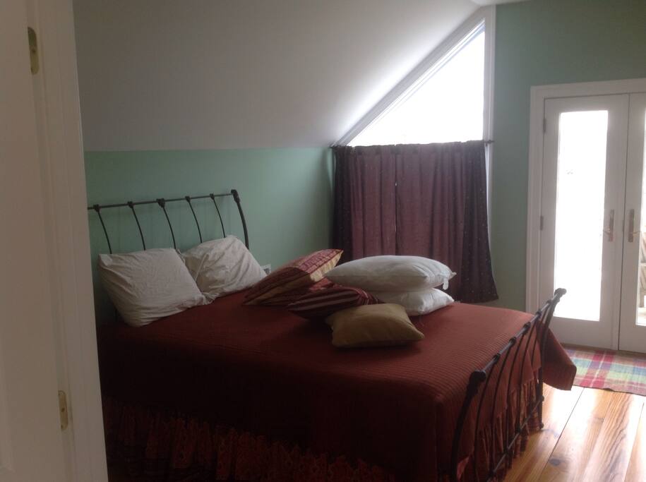 Waterside bedroom with private bath with queen bed