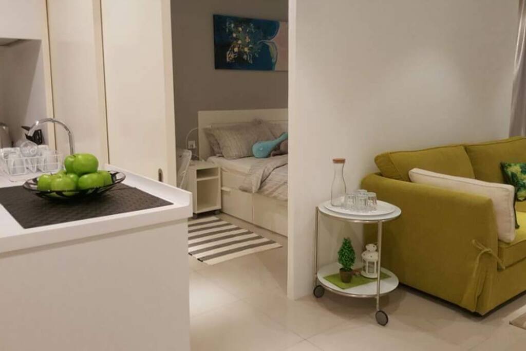 Partition separating bed area from sitting area