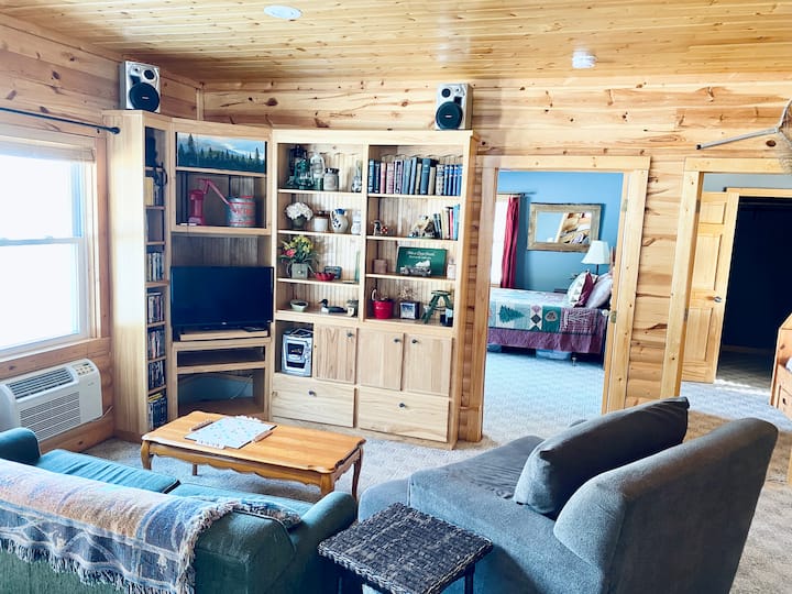 The main living area is a great space for watching a movie, playing games or reading a book. We have a wide selection of DVDs and games and it’s a smart TV that you can connect to your streaming services. The couch is a pullout full-size bed. 