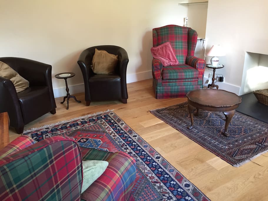 Bright sitting room with aspect over garden. TV and wifi