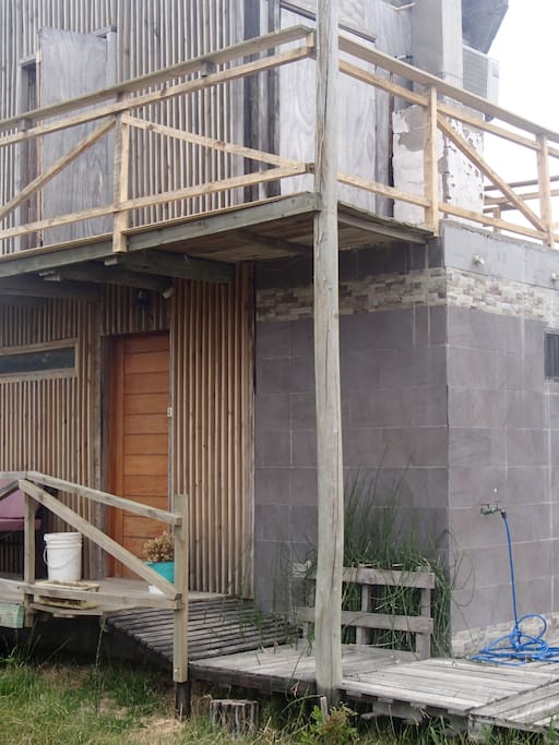 Terraza de planta alta con deck
