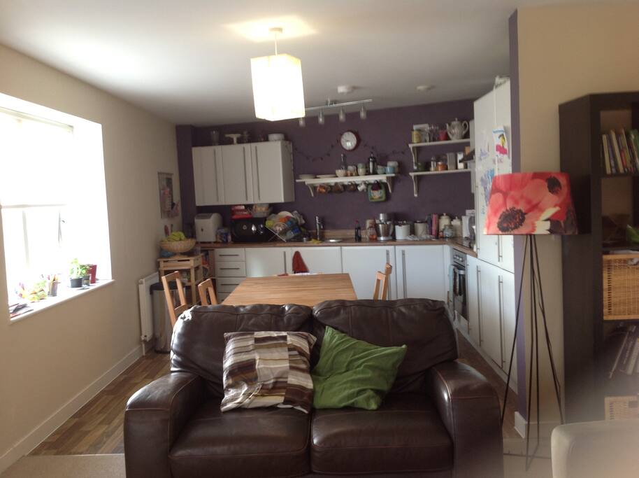 Connected to a large, modern kitchen