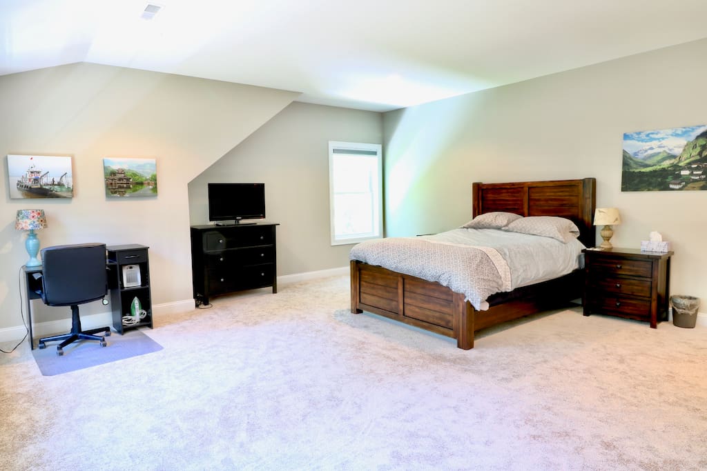 A work desk, clothes hanging rack, plenty of drawer space and TV are included in the main room.