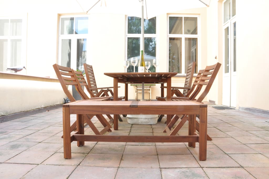 Great private terrace with garden furniture, barbecue - comfortable sitting for twelve guests. Suitable for breakfasts or evening private parties.