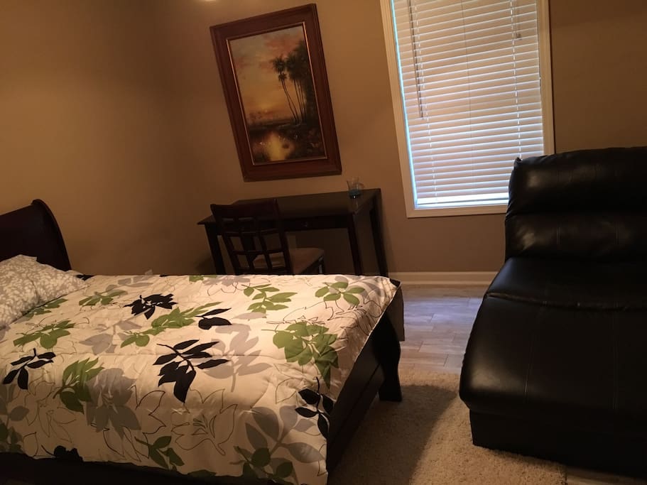 Guest bedroom number one. Twin sized bed and work station area.