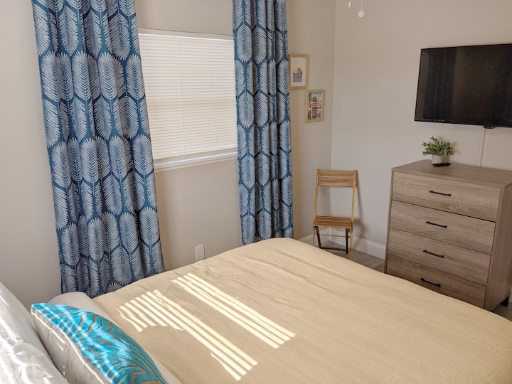 The east bedroom gets incredible natural light—but we have blackout curtains in addition to blinds, so you can sleep in.