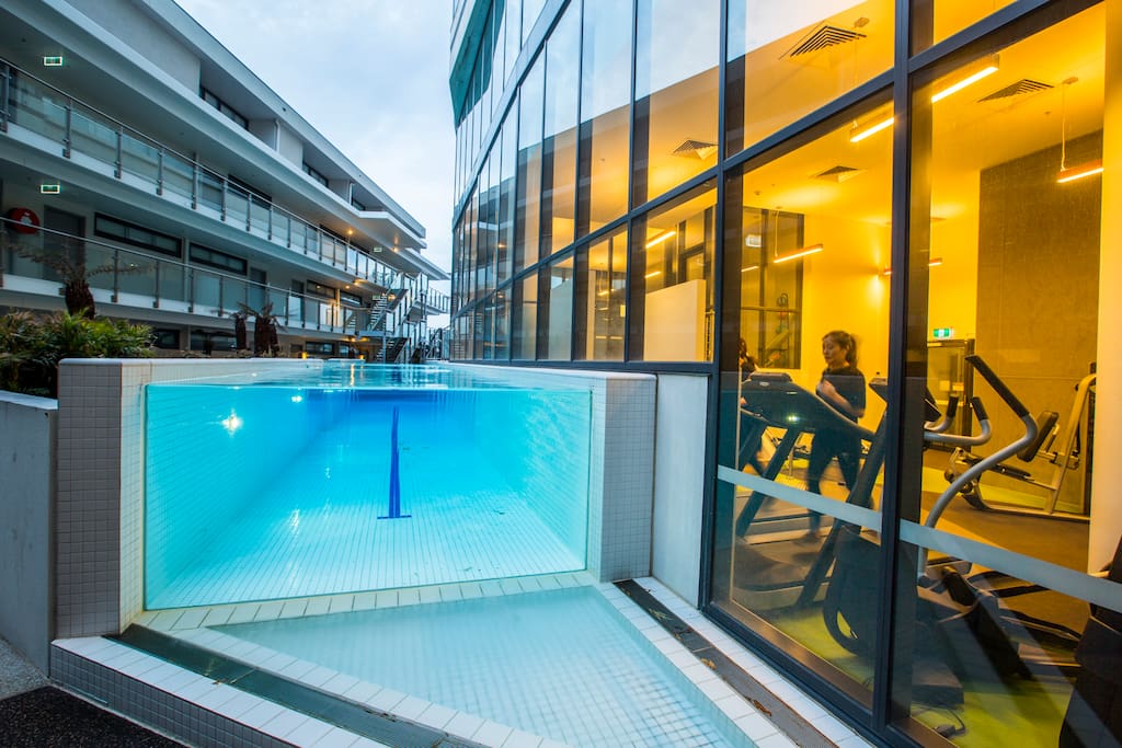 Infinity heated outdoor pool overlooking the gym