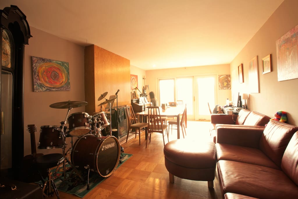 Here is the living room and dining room. There is a deck with an amazing view outside the glass door.