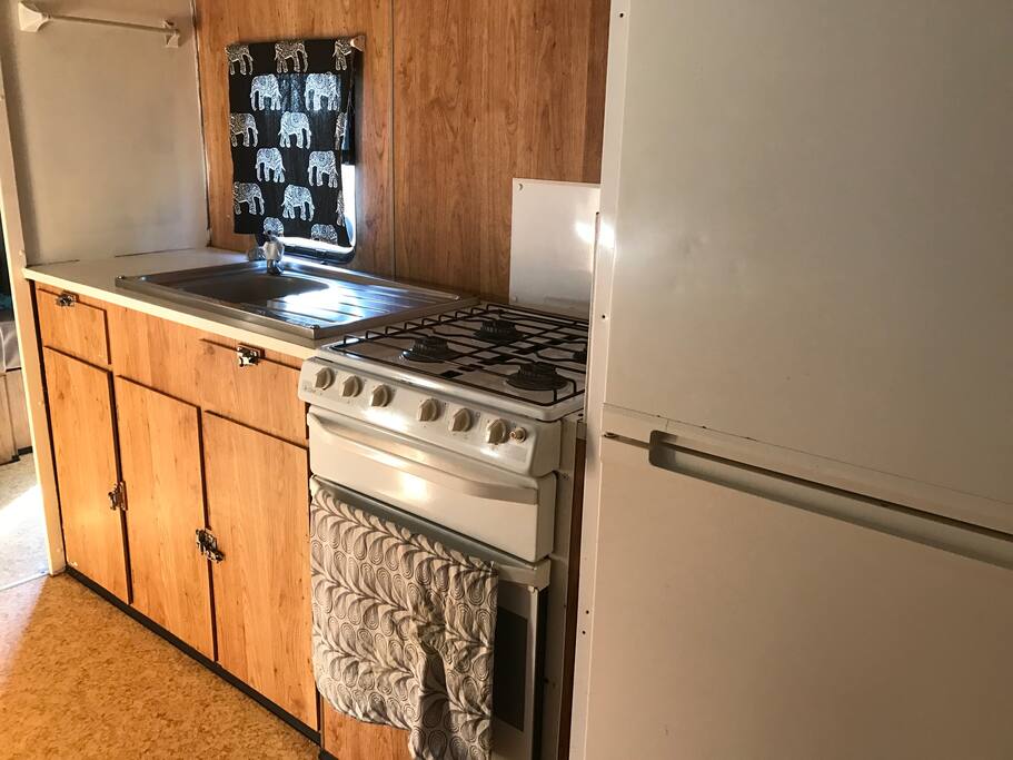 Gas stove and fridge in kitchen
