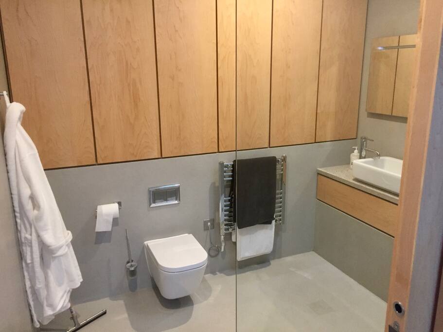 Guest bathroom 1, ensuite with rainfall shower.