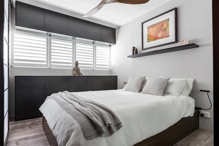 Rest easy in the bedroom with a plush queen bed, ceiling fan and plenty of storage.