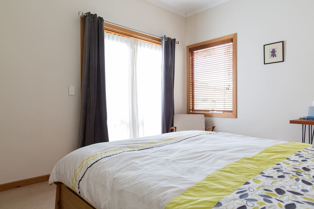 Your light and airy bedroom with French doors to garden.
