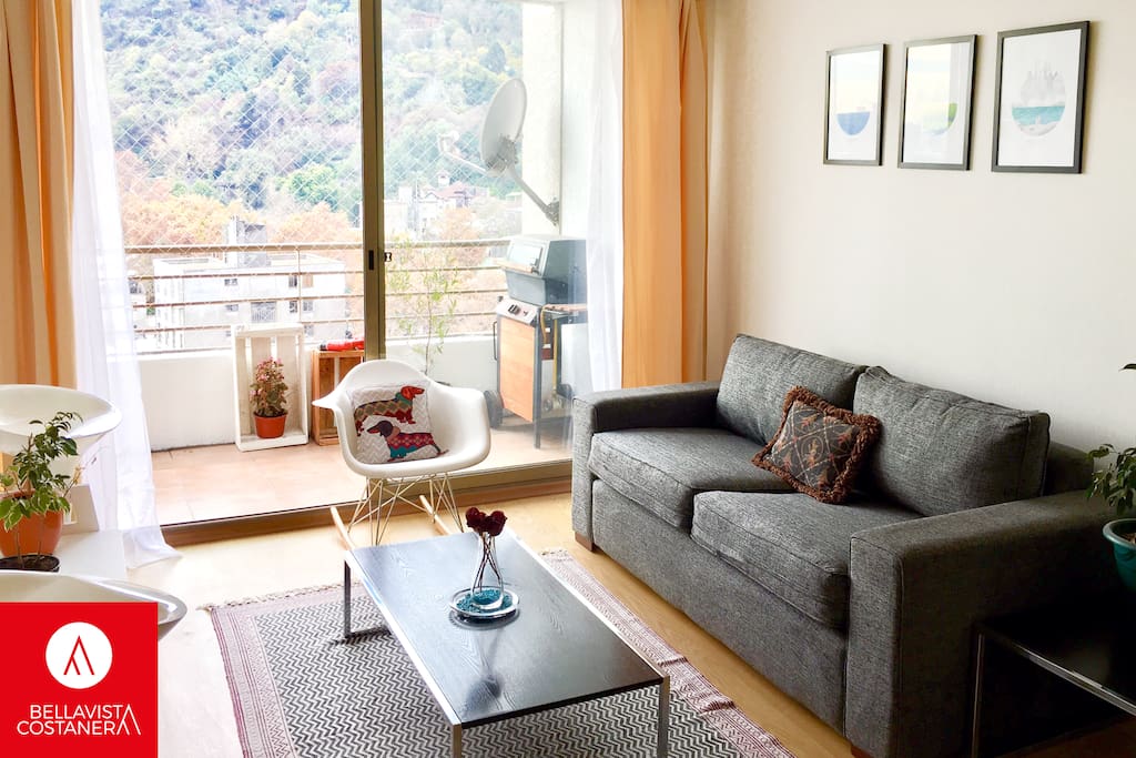 Living room and balcony, beautiful view: Cerro San Cristobal and Costaner Center.