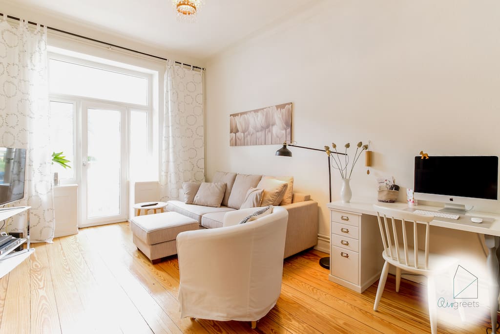 The spacious room offers a comfortable couch to relax after a busy day.