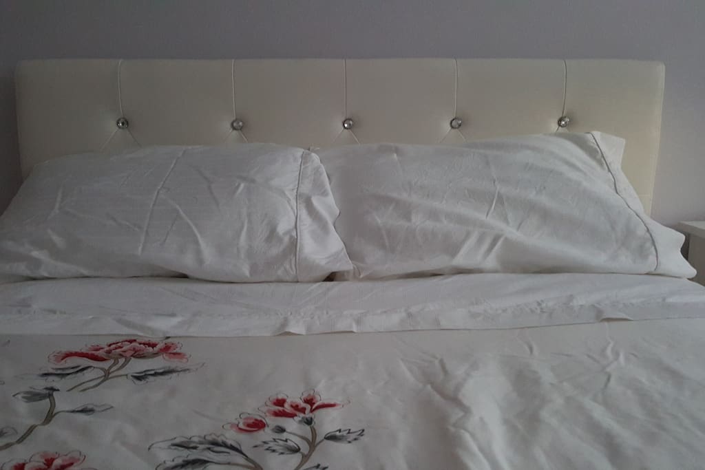 New double bed with comforter and sheets