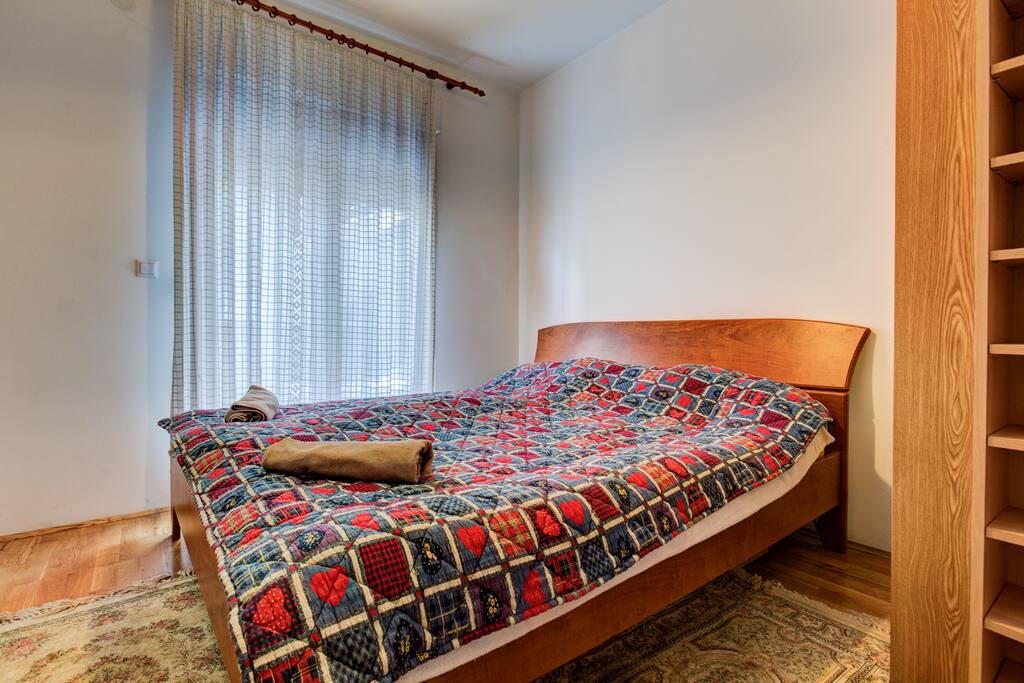 Double bed in the first bedroom.