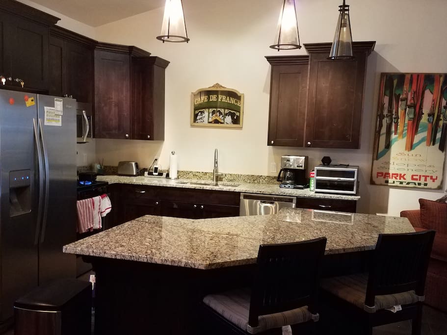 Kitchen with large island and bar stools