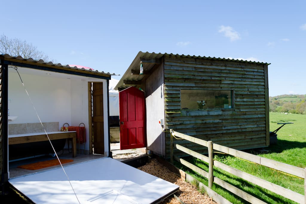 Picture of the bathroom drawbridge wall pulled down for an ultimate al fresco bathing experience