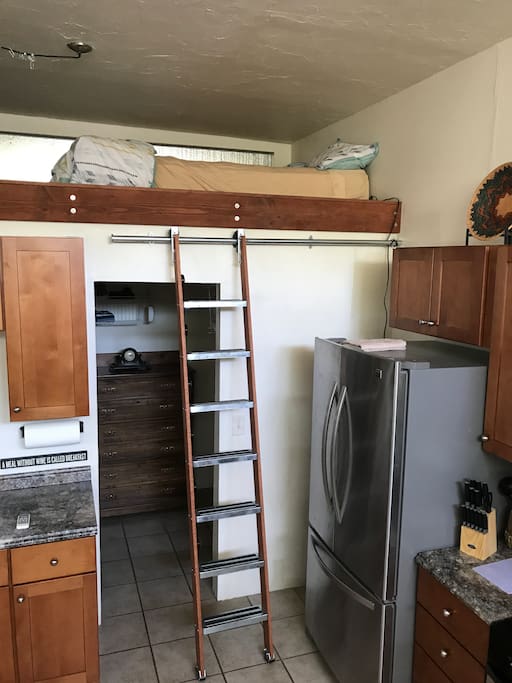 Roll away ladder to loft space with queen sized bed
