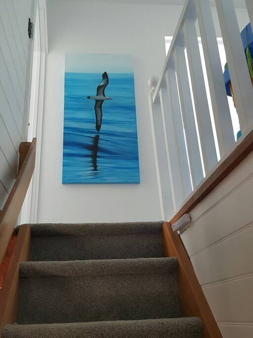 Stairs leading to two bedrooms upstairs and a new bathroom
