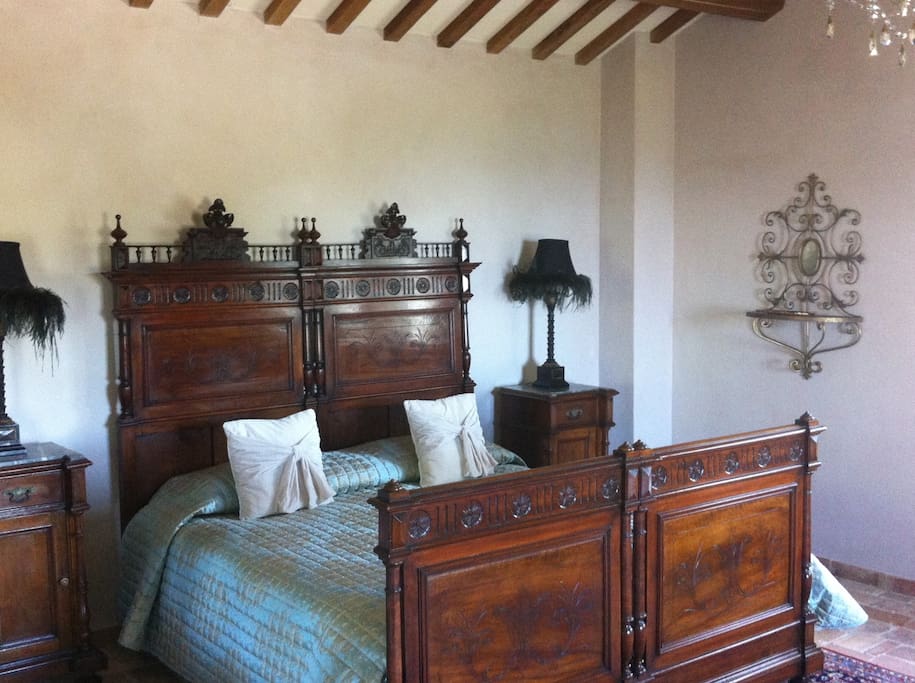 Bedroom on second floor. This bedroom has its own patio overlooking pool, vineyard and Adriatic.