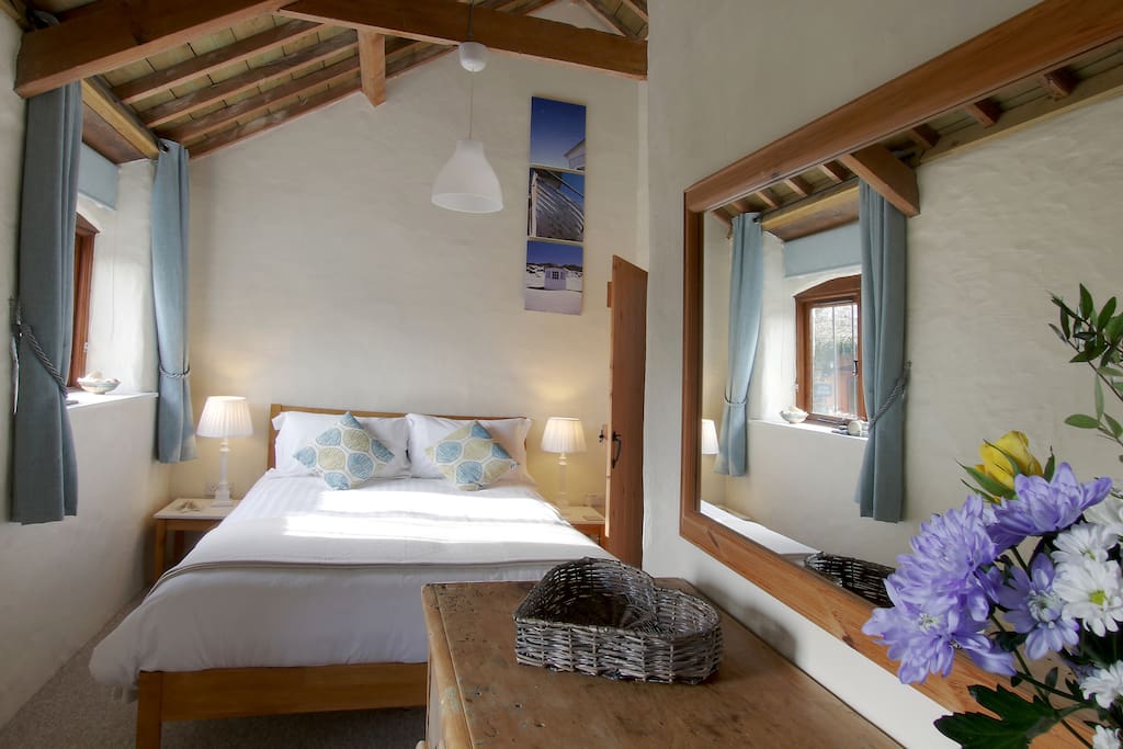 The main bedroom has a king-size bed & en-suite shower room