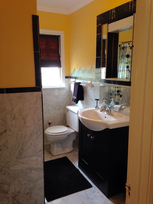 Private, full size bath with tub and shower.