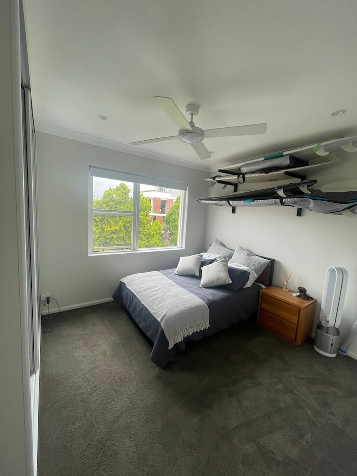 Modern beachside apartment with water views.