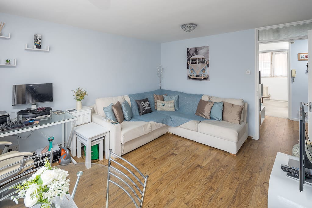 Bright spacious living area with a comfy sofa bed