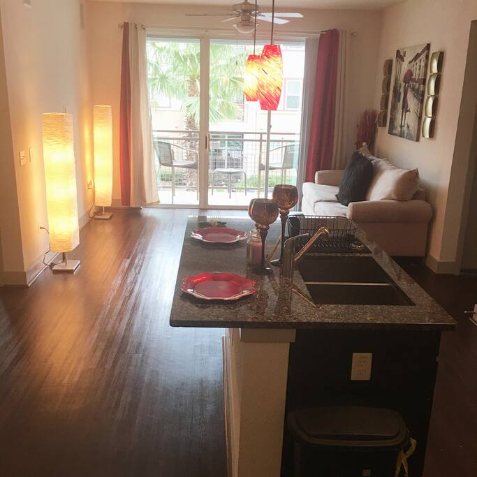 Kitchen view of the living room and balcony.