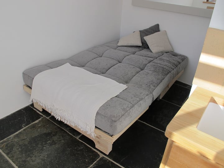 Sofa bed, full pull out. Wool duvet and pillows from the Woolroom. 100% organic cotton bedding and a cotton waterproof mattress protector.