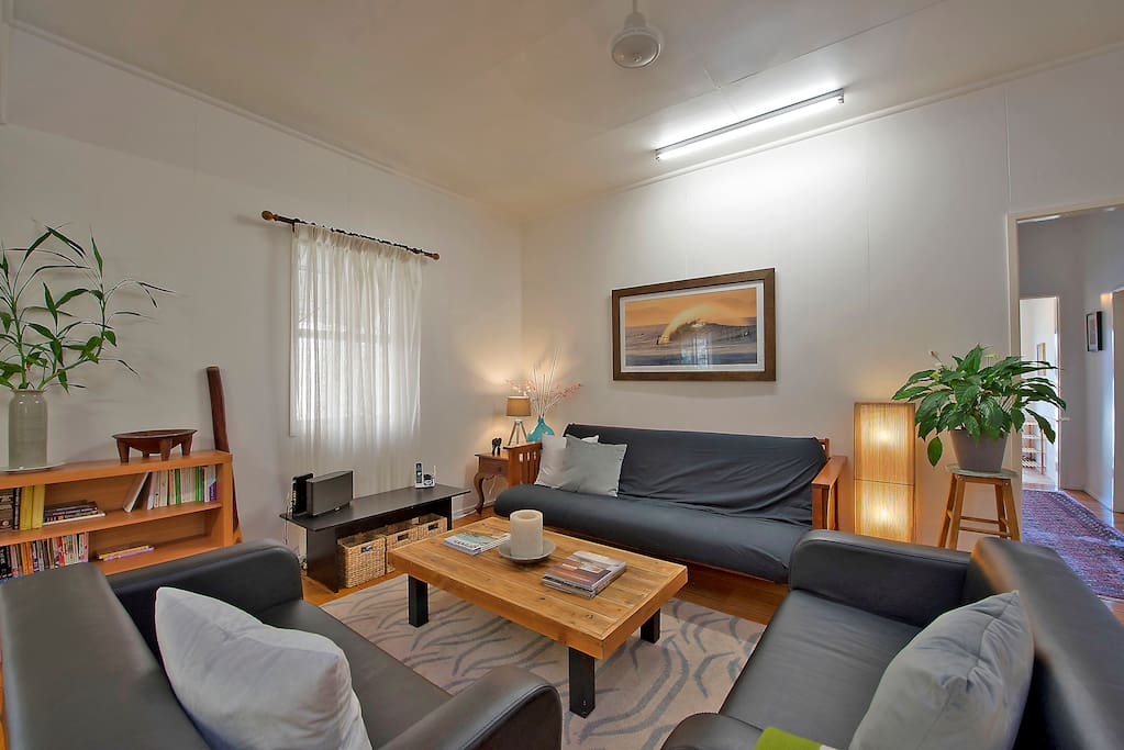 The living space with fold-out double futon couch, TV (behind the curtain) and DVD player