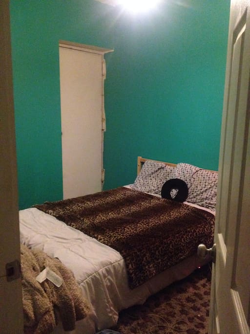Shows a little bit more room, the door in the corner leads to back alley