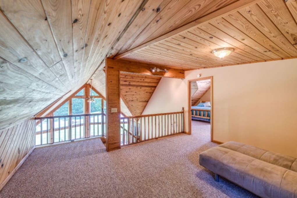 Loft area with adjacent bedroom and bathroom