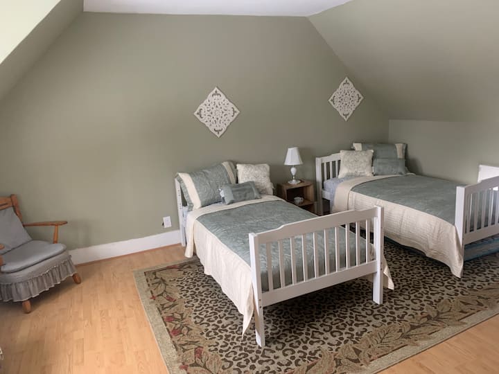 The Bunk Room:  The bunk room or “lodge room” is a private room away from the hubbub and is perfect for the kids. It has two twin beds and sleeps 2-3. There is an extra mattress under one of the beds. 