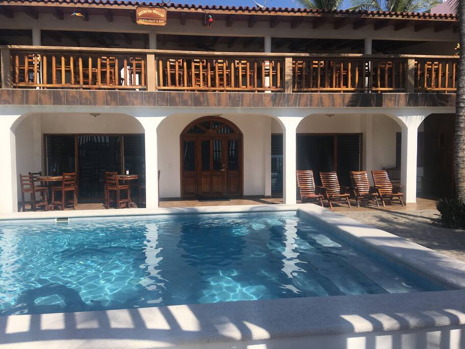 Pool area and entrance to hotel
