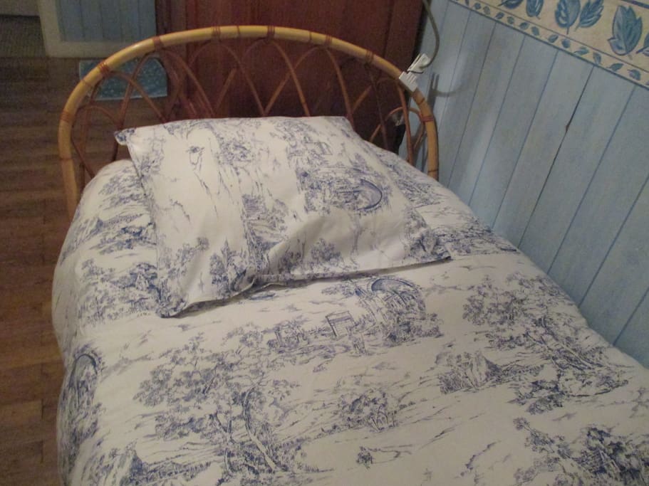 Le lit et sa couette en duvet de canard