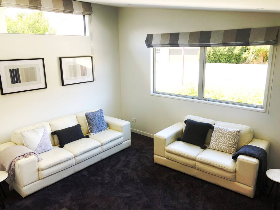 Large modern & contemporary living room with Sky TV.