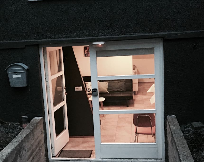 The entrance to the apartment is behind the house, not visable from the street.
